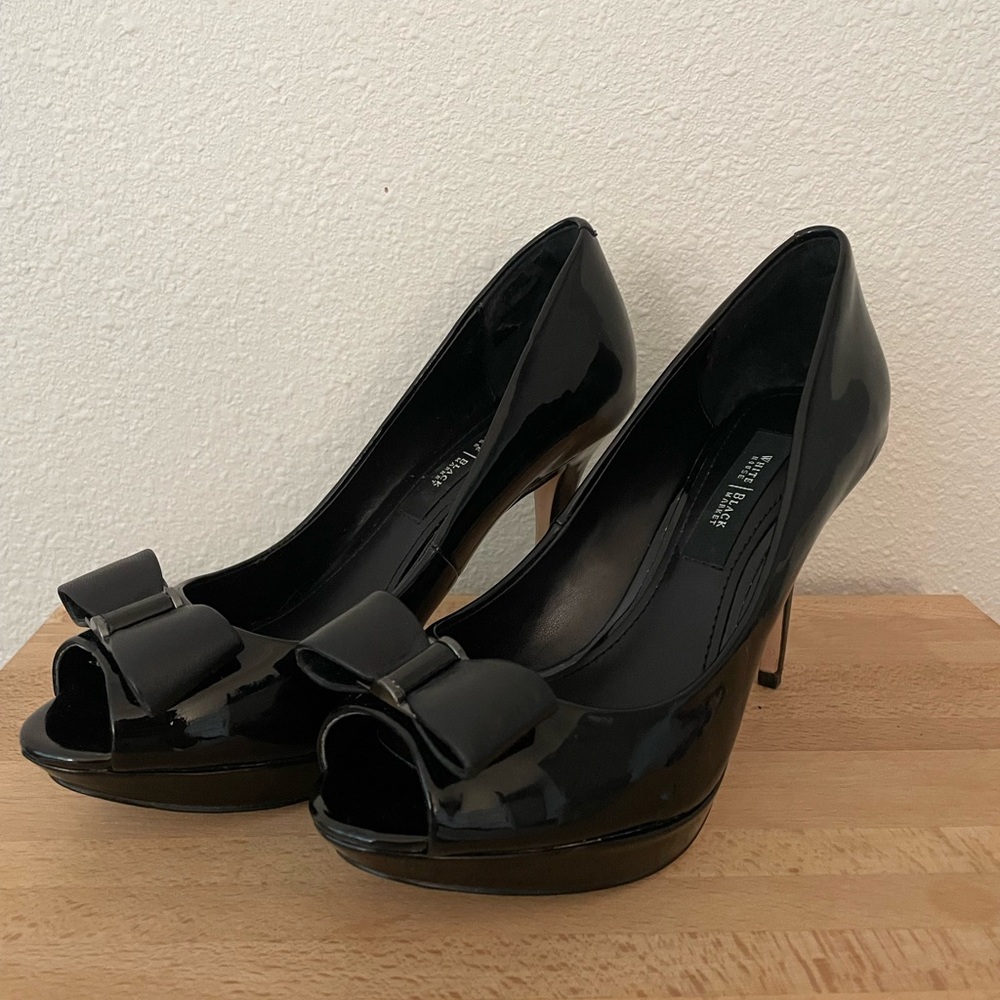 White House Black Market black patent leather platform heels with bows